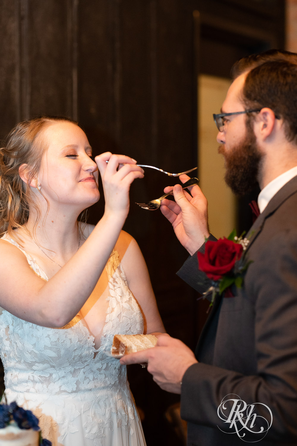 Bride and groom eating wedding cake at the Jerome Event Center in Delano, Minnesota.