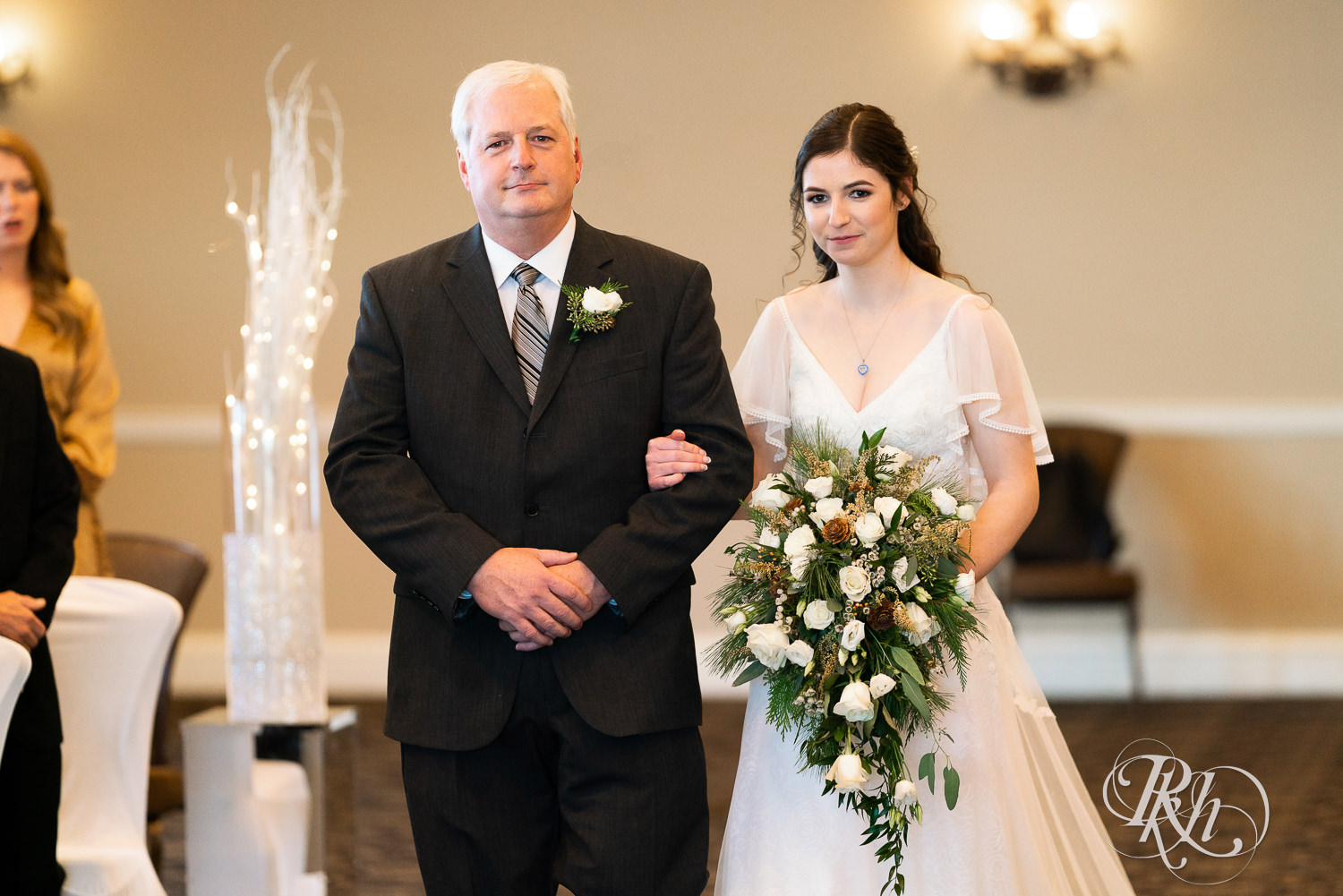 Bride walking down the aisle with dad at wedding ceremony at Minneapolis Golf Club in Saint Louis Park, Minnesota.