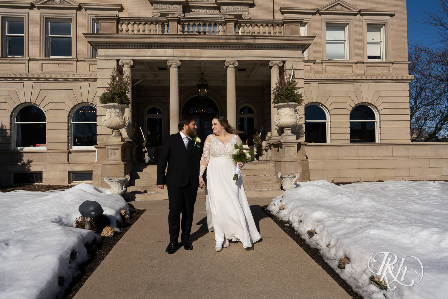 Bride and groom walking at Semple Mansion in Minneapolis, Minnesota.