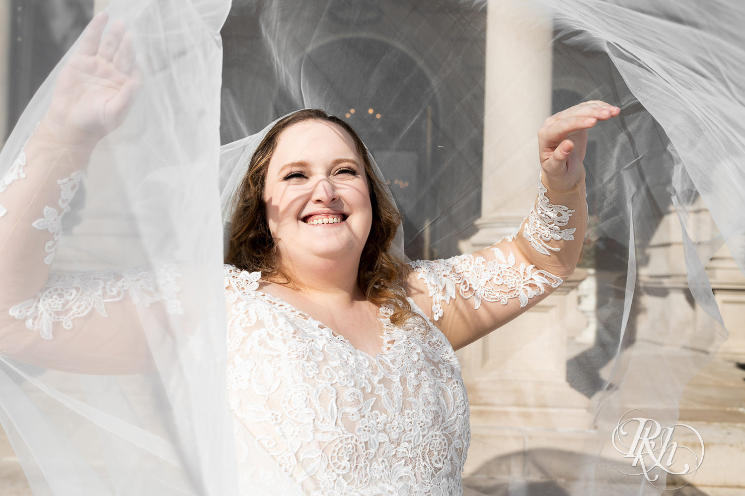 Bride smiling under veil at Semple Mansion in Minneapolis, Minnesota.