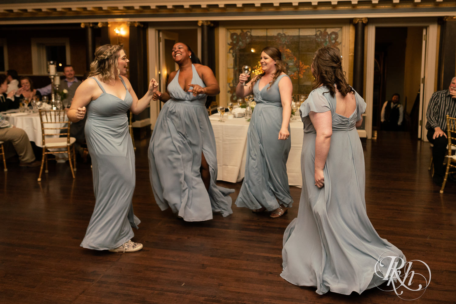 Bridesmaid dance during grand entrance at Semple Mansion in Minneapolis, Minnesota.