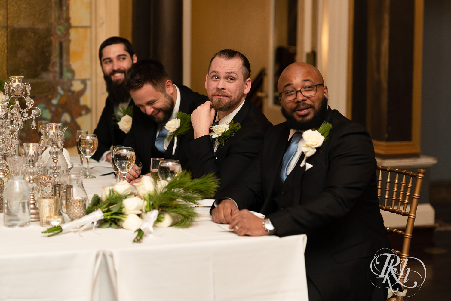 Wedding party laughs during speeches at Semple Mansion in Minneapolis, Minnesota.