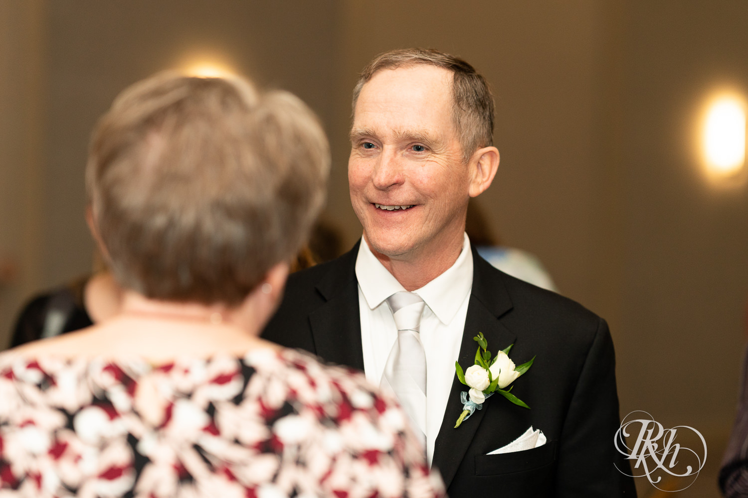 Guests mingle at wedding reception at Doubletree Hilton Saint Paul in Saint Paul, Minnesota.