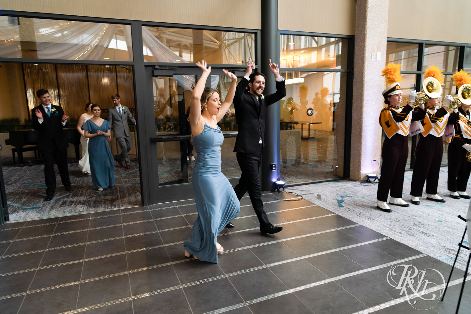 Wedding party enters wedding reception at Doubletree Hilton Saint Paul in Saint Paul, Minnesota.