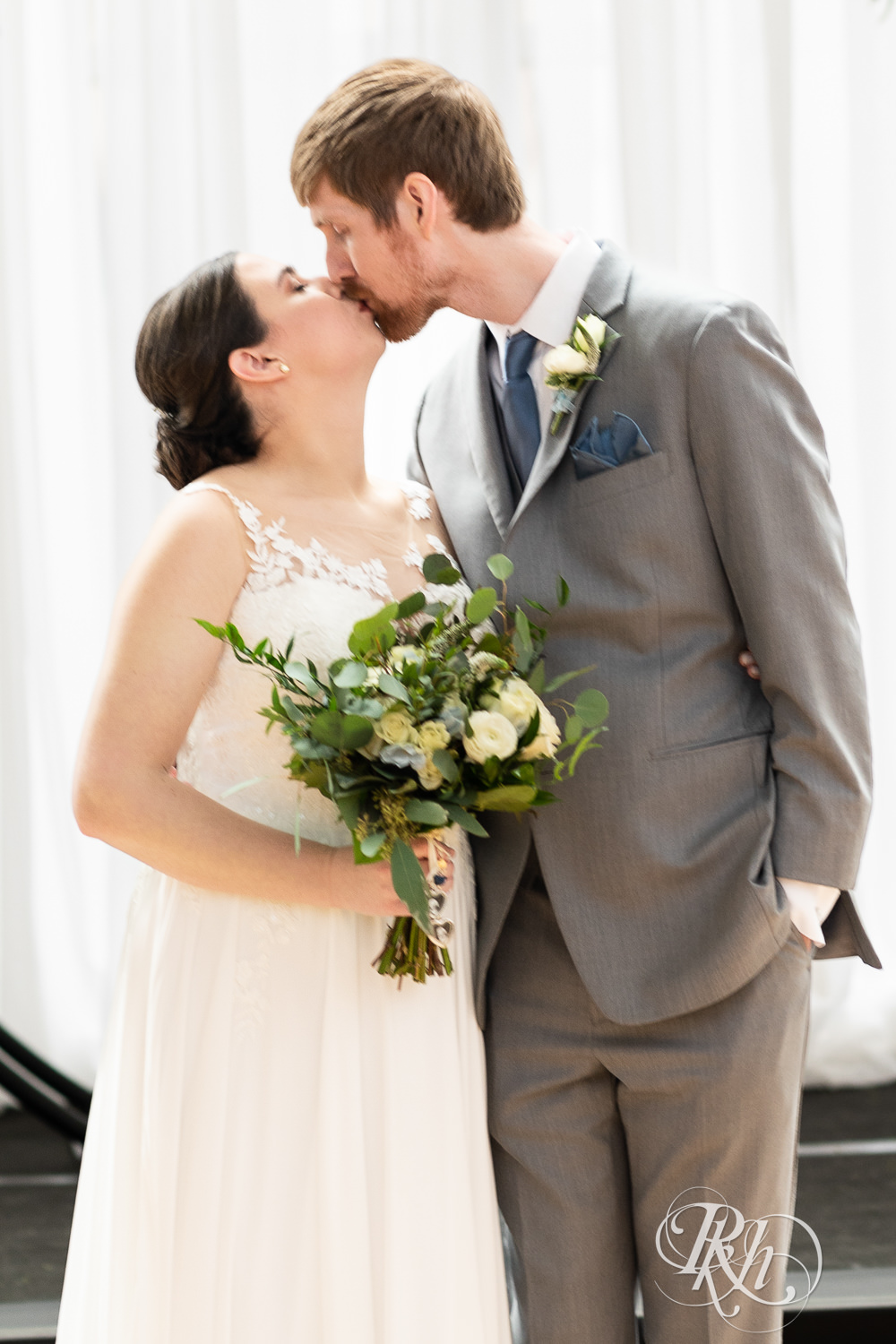 Bride and groom kiss at Doubletree Hilton Saint Paul in Saint Paul, Minnesota.