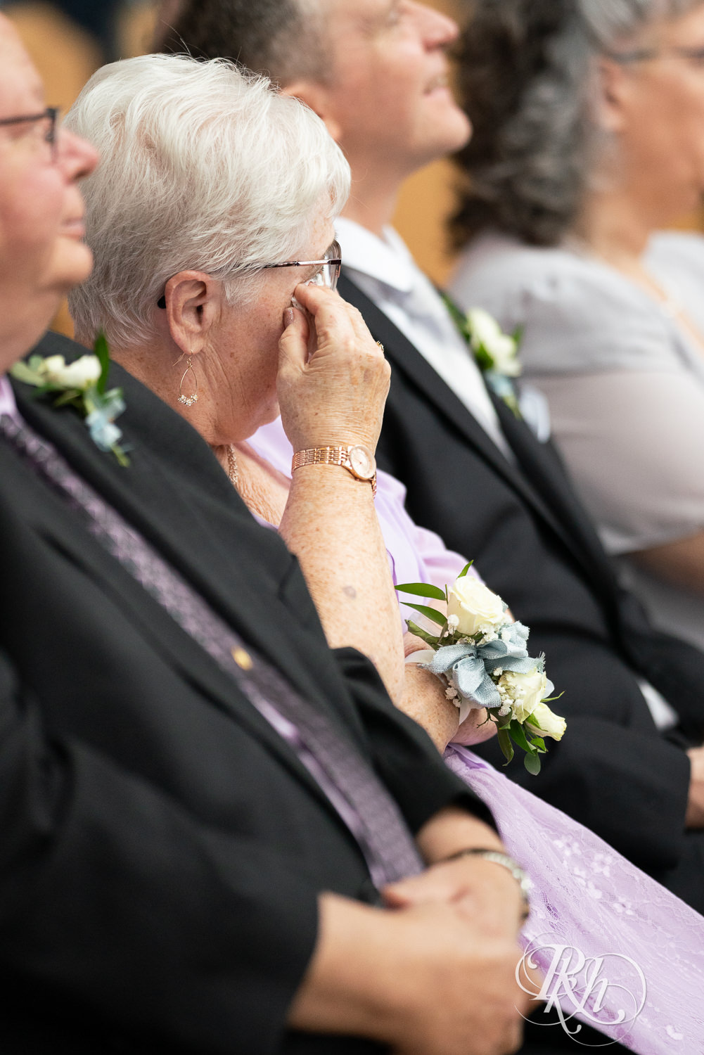 Groom's grandma cries during wedding ceremony at Doubletree Hilton Saint Paul in Saint Paul, Minnesota.