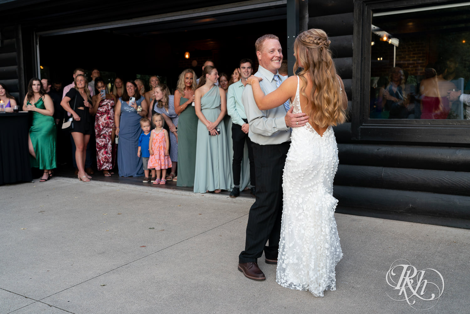 Bride her dad dance during wedding reception at Ahavah Cottage in Elysian, Minnesota.