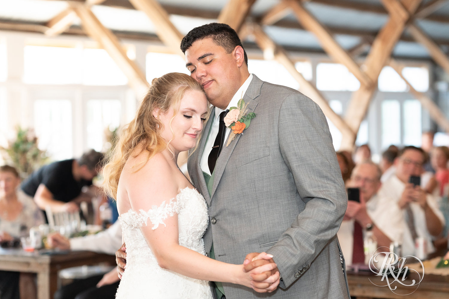 Bride and groom share first dance at wedding reception at Cottage Farmhouse in Glencoe, Minnesota.