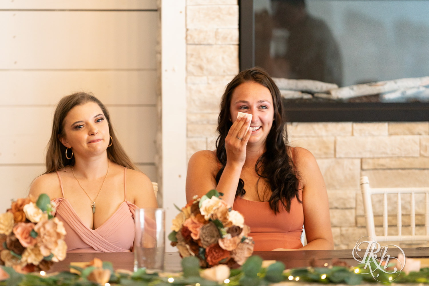 Bridesmaid cries watching bride and groom share first dance at wedding reception at Cottage Farmhouse in Glencoe, Minnesota.