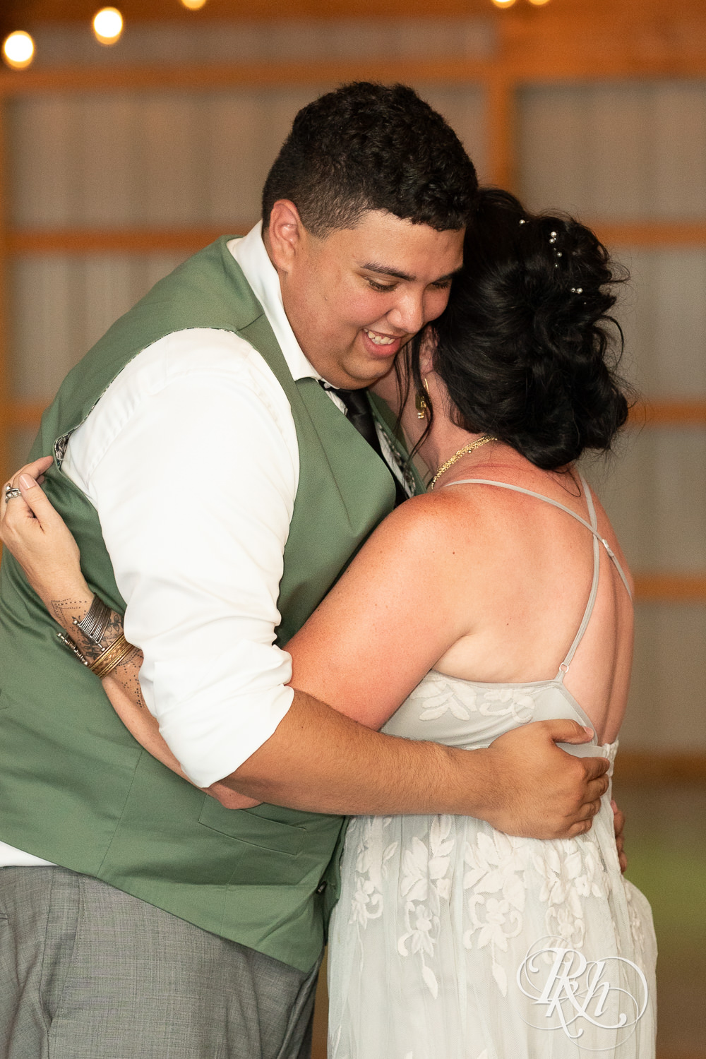 Groom dances with mom at wedding reception at Cottage Farmhouse in Glencoe, Minnesota.