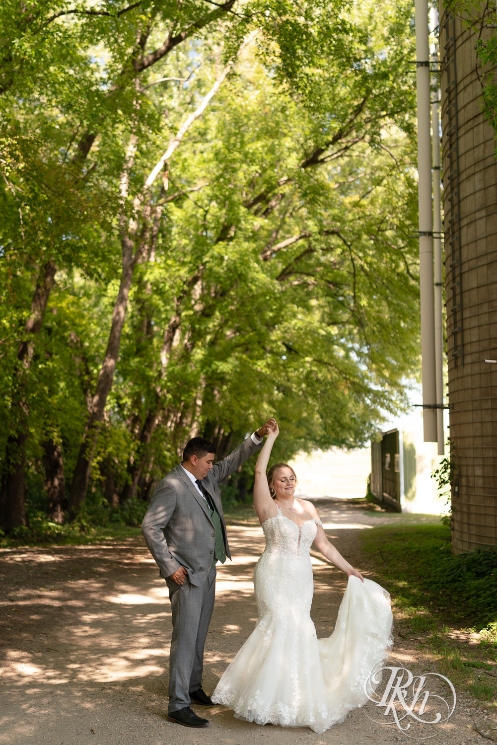 Bride and groom dance on wedding day at Cottage Farmhouse in Glencoe, Minnesota.