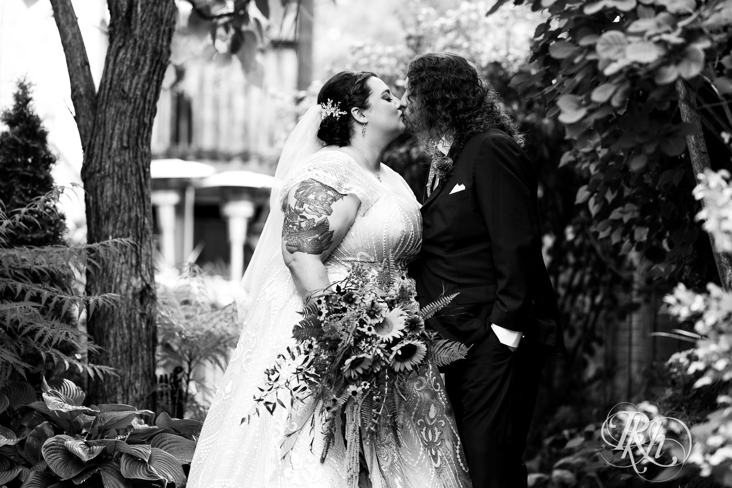 Bride and groom kiss during fall wedding at Kellerman's Event Center in White Bear Lake, Minnesota.