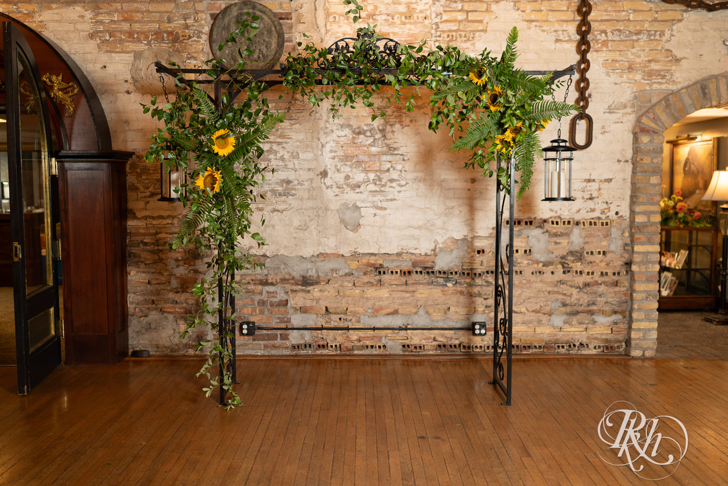 Wedding ceremony arch with sunflowers at Kellerman's Event Center in White Bear Lake, Minnesota.