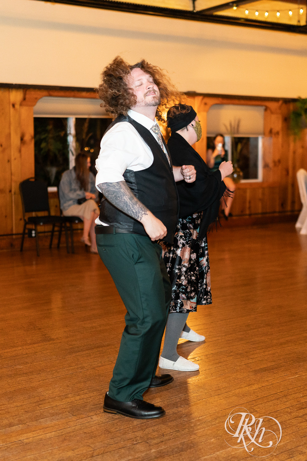 Groom and sister dance at wedding reception at Kellerman's Event Center in White Bear Lake, Minnesota.