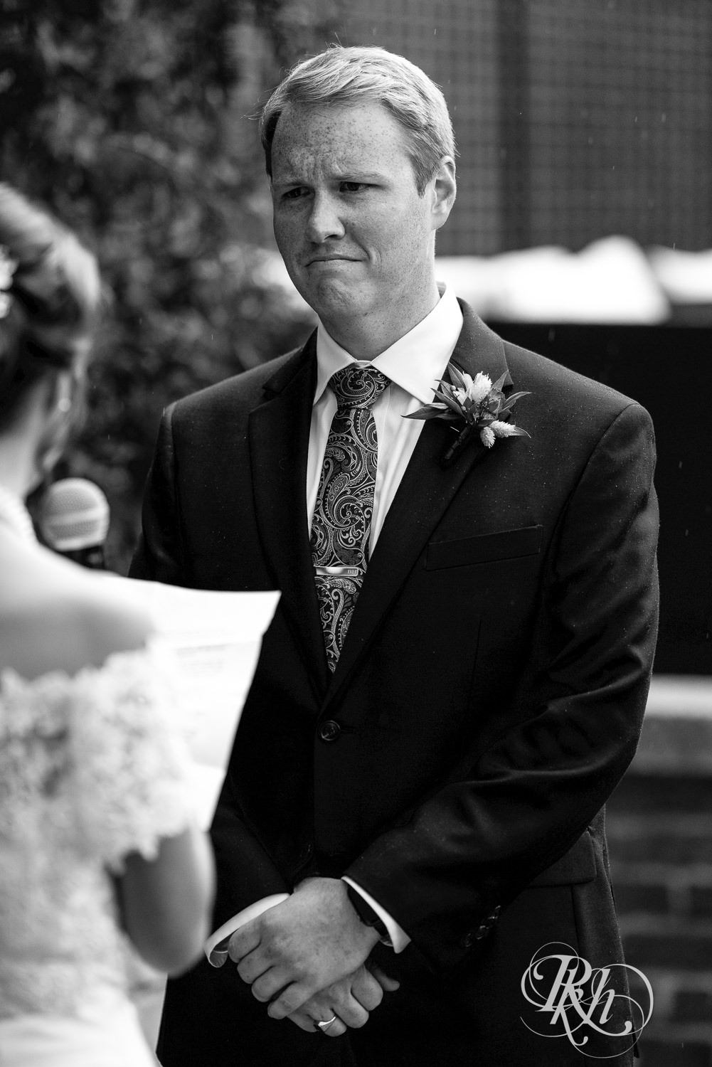 Groom cries during wedding ceremony at The Grand 1858 in Minneapolis, Minnesota.