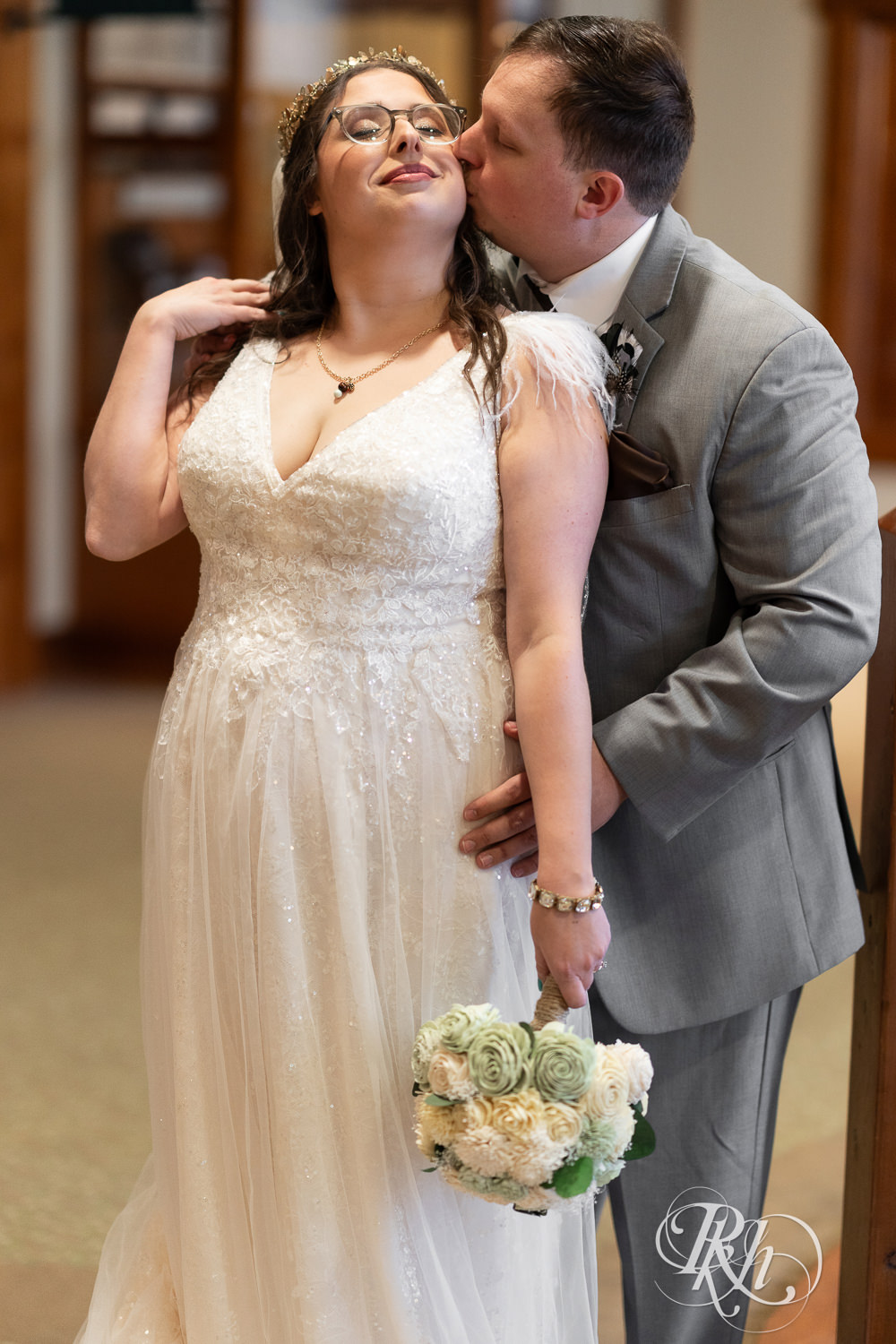Bride and groom smile at Bunker Hills Event Center in Coon Rapids, Minnesota.