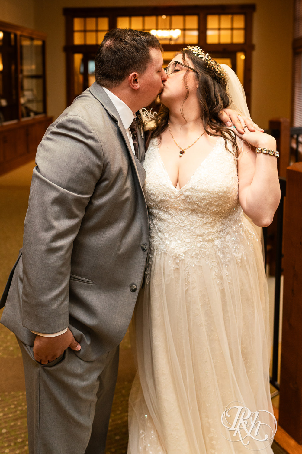 Bride and groom kiss at Bunker Hills Event Center in Coon Rapids, Minnesota.
