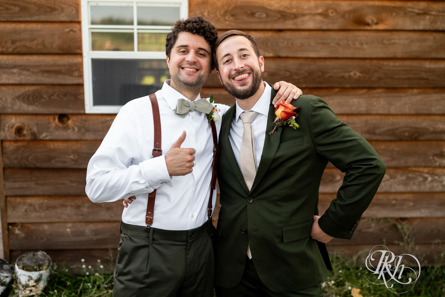 Groom smiles with wedding party on wedding day at Hayvn at Hay River in Boyceville, Wisconsin. 