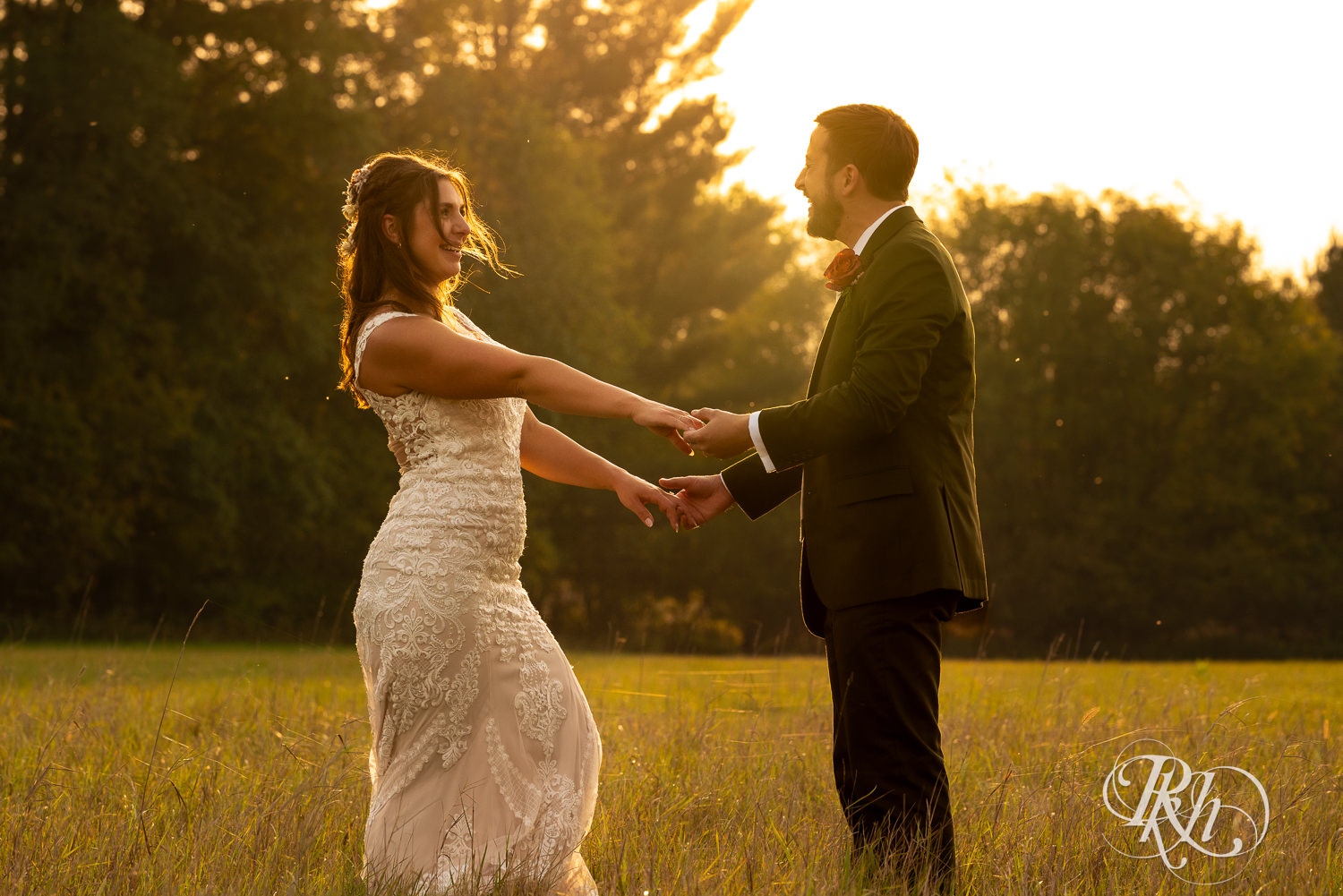 Bride and groom dance in the sunset at Hayvn at Hay River in Boyceville, Wisconsin. 