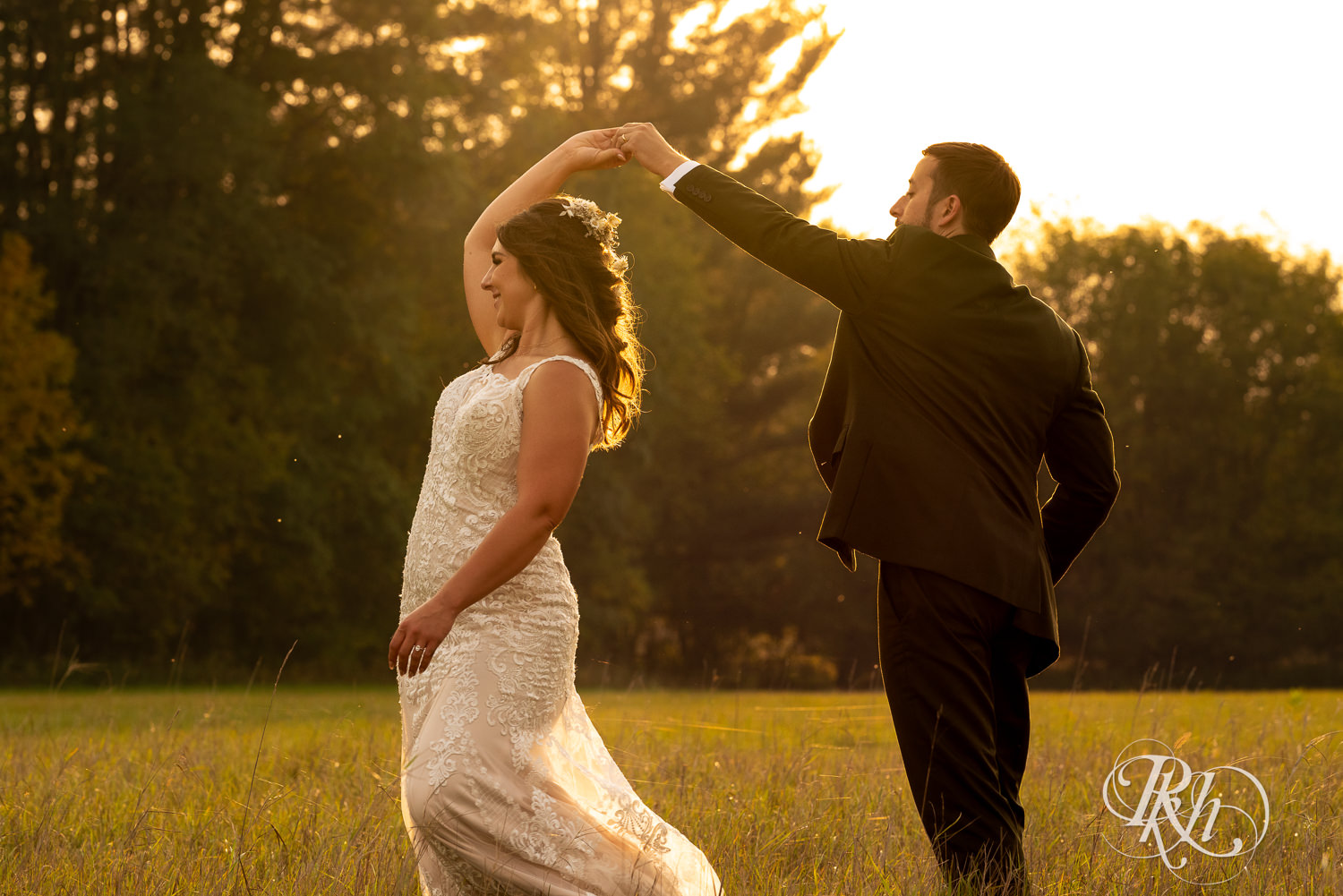 Bride and groom dance in the sunset at Hayvn at Hay River in Boyceville, Wisconsin. 