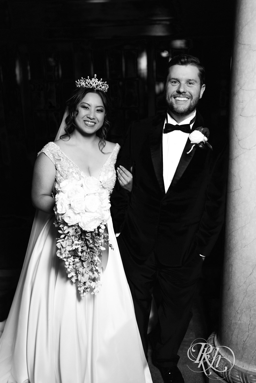 Hmong bride and groom smile on wedding day at the Saint Paul Athletic Club in Saint Paul, Minnesota.