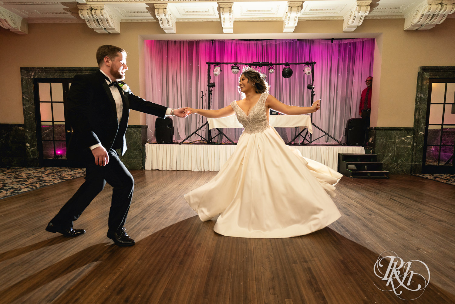 Hmong bride and groom share first dance at the Saint Paul Athletic Club in Saint Paul, Minnesota.