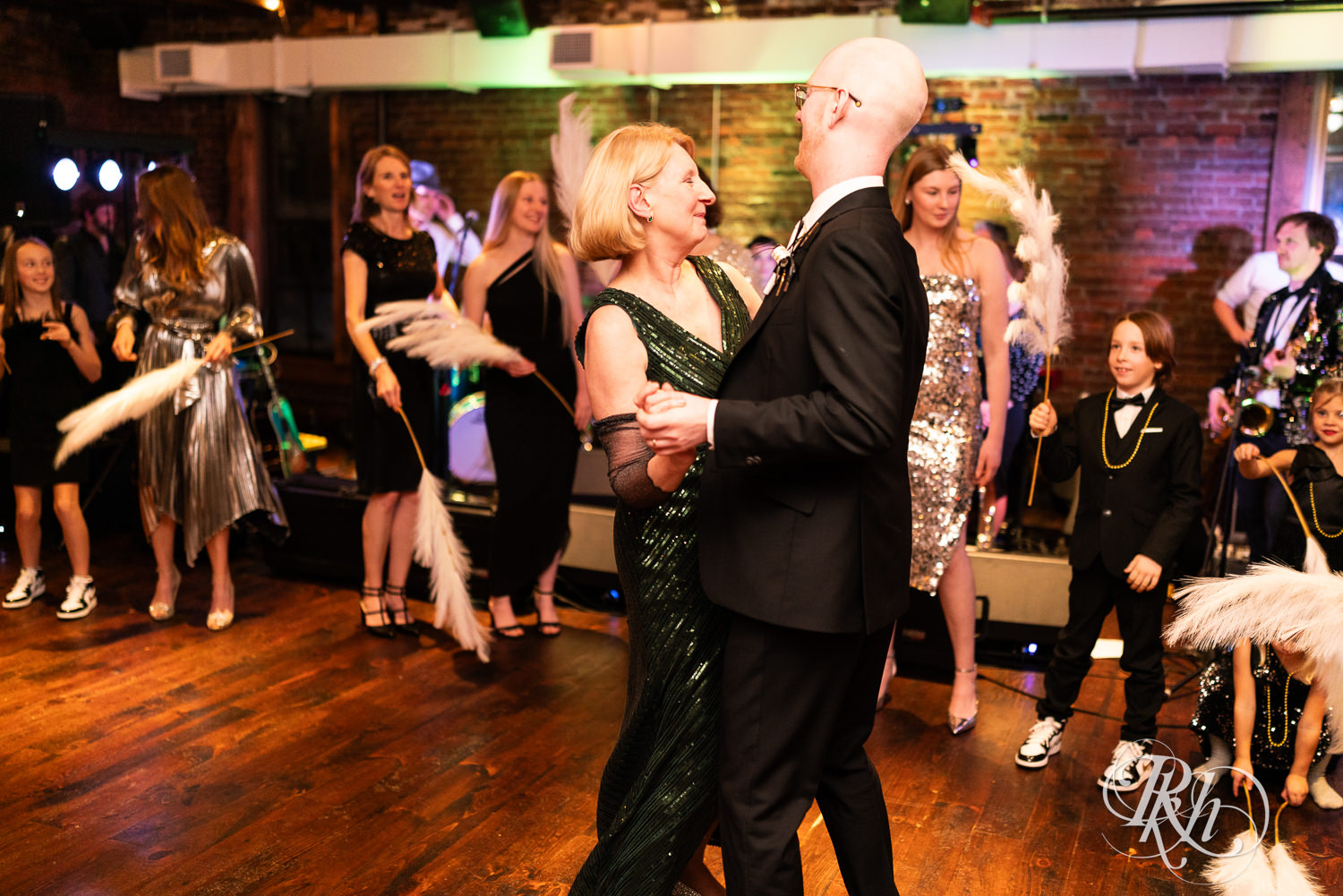 Groom and mom dance during wedding reception at Gatherings at Station 10 in Saint Paul, Minnesota.