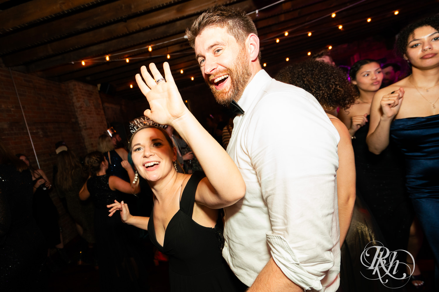 Guests dance during wedding reception at Gatherings at Station 10 in Saint Paul, Minnesota.