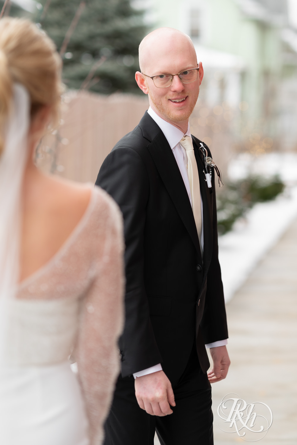 Bride and groom do first look during winter wedding at Gatherings at Station 10 in Saint Paul, Minnesota.