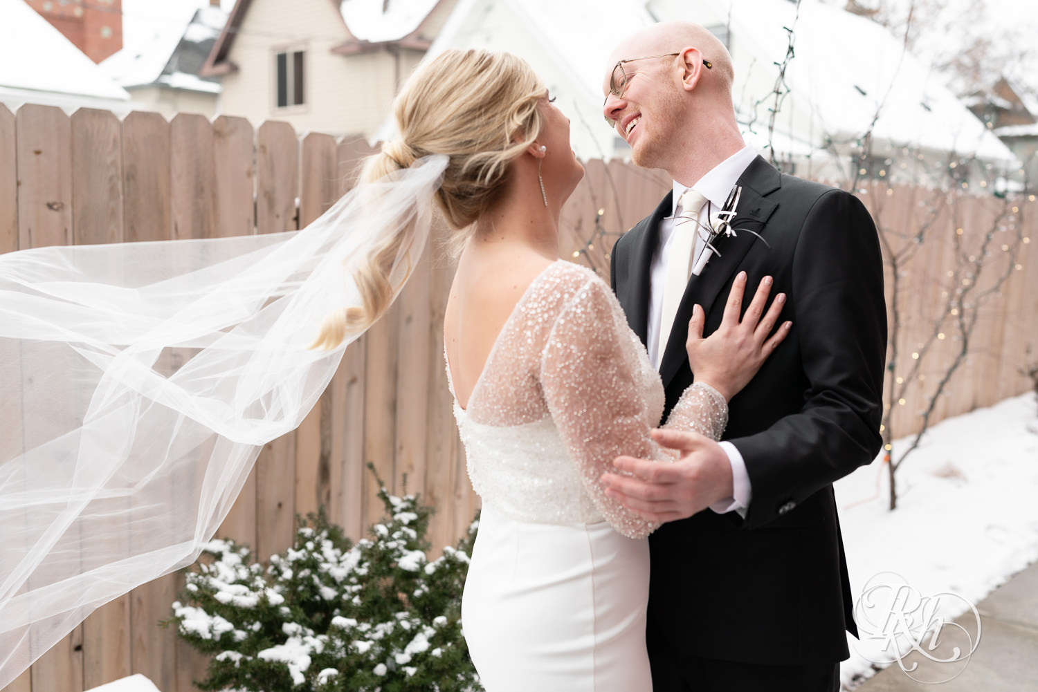 Bride and groom do first look during winter wedding at Gatherings at Station 10 in Saint Paul, Minnesota.