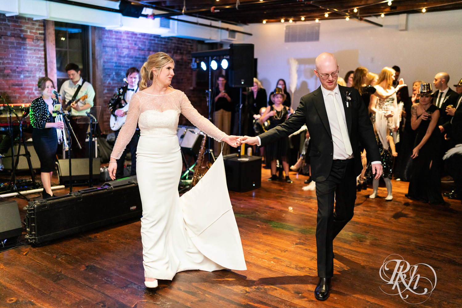 Bride and groom have first dance during wedding reception at Gatherings at Station 10 in Saint Paul, Minnesota.