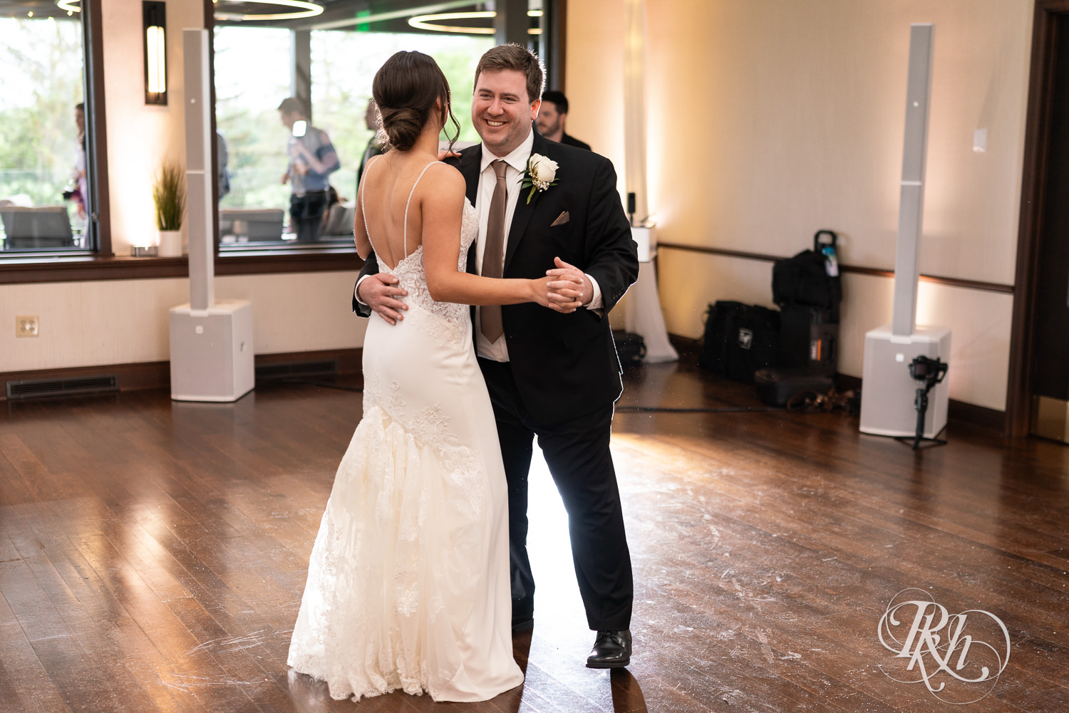 Bride and groom share first dance during wedding reception at Olympic Hills Golf Club in Eden Prairie, Minnesota.