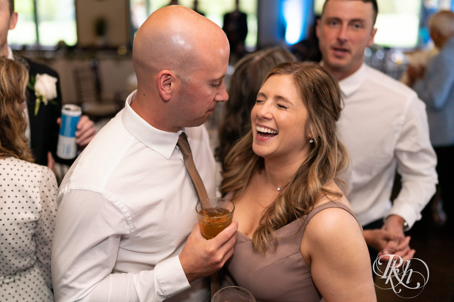 Guests dance during wedding reception at Olympic Hills Golf Club in Eden Prairie, Minnesota.