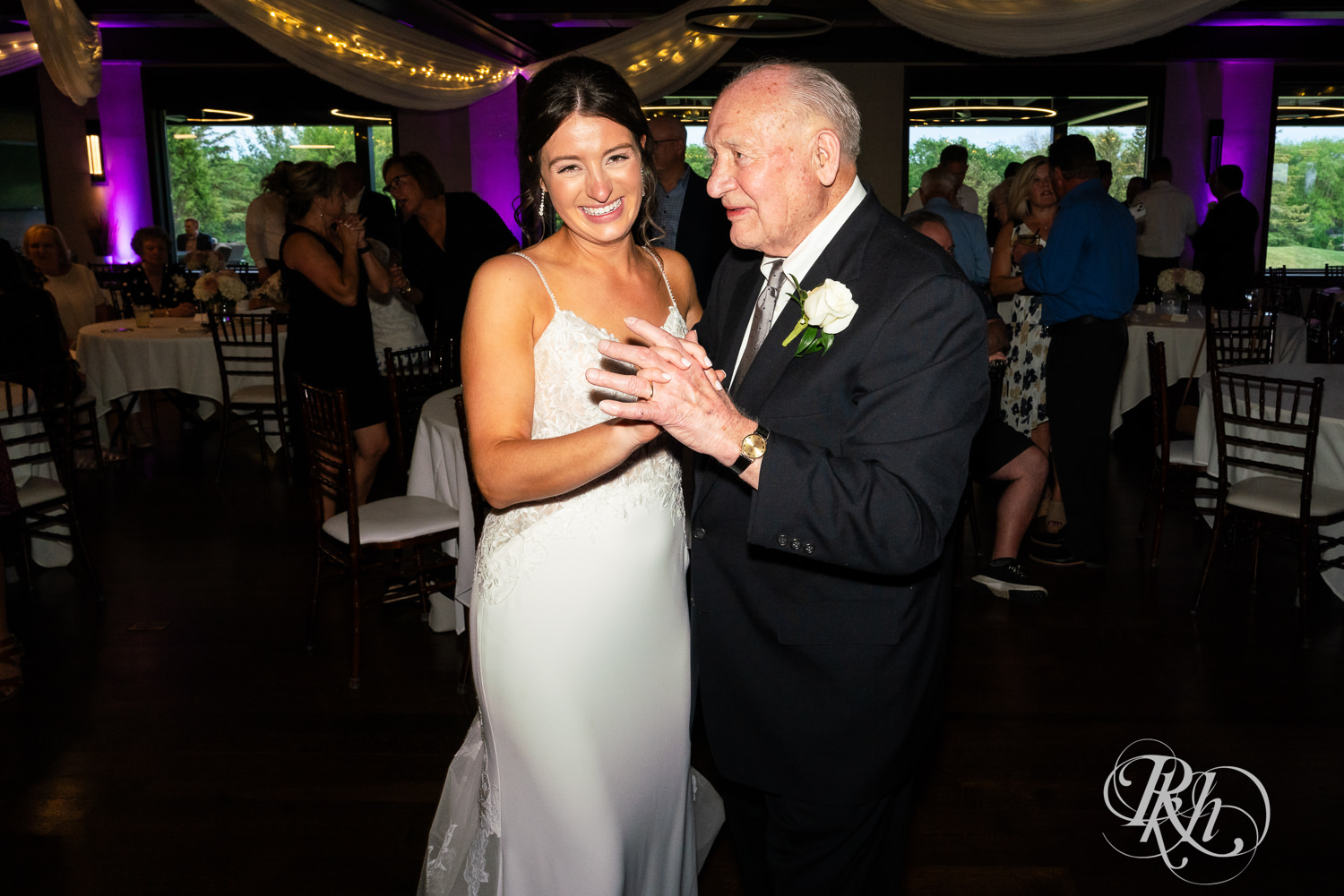 Guests dance during wedding reception at Olympic Hills Golf Club in Eden Prairie, Minnesota.