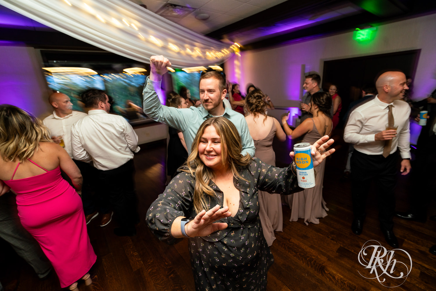 Guests dance during wedding reception at Olympic Hills Golf Club in Eden Prairie, Minnesota.