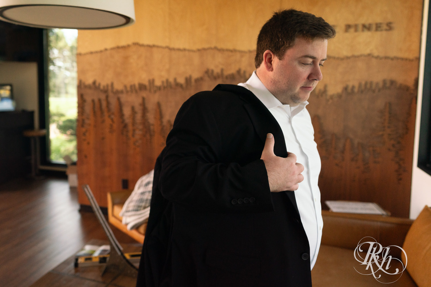 Groom getting dressed at Olympic Hills Golf Club in Eden Prairie, Minnesota.