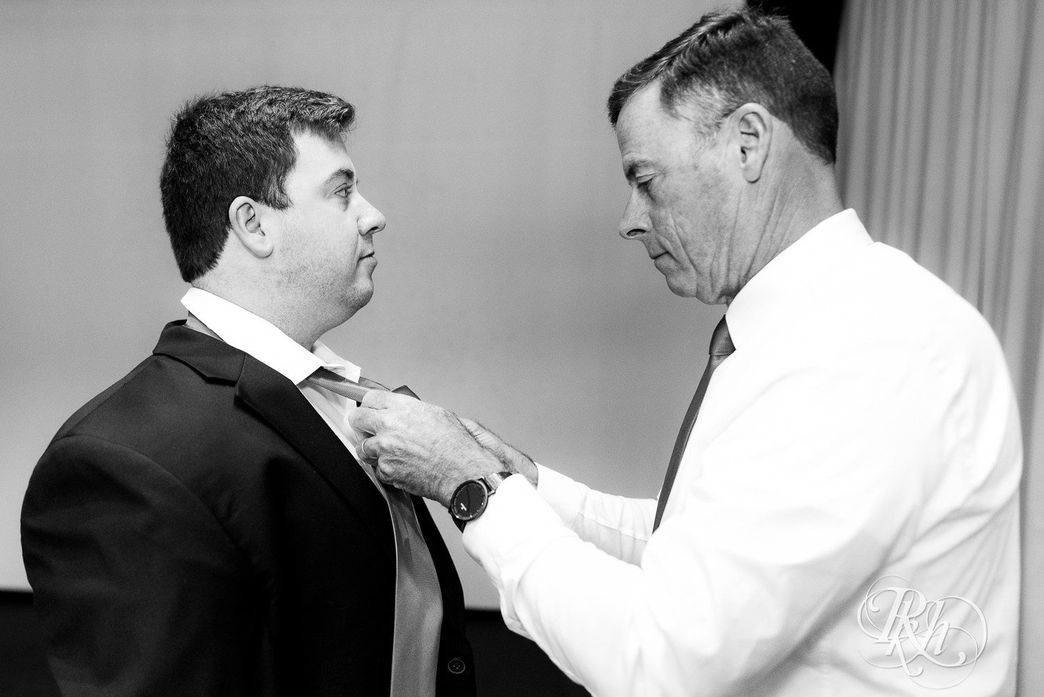 Groom getting dressed at Olympic Hills Golf Club in Eden Prairie, Minnesota.