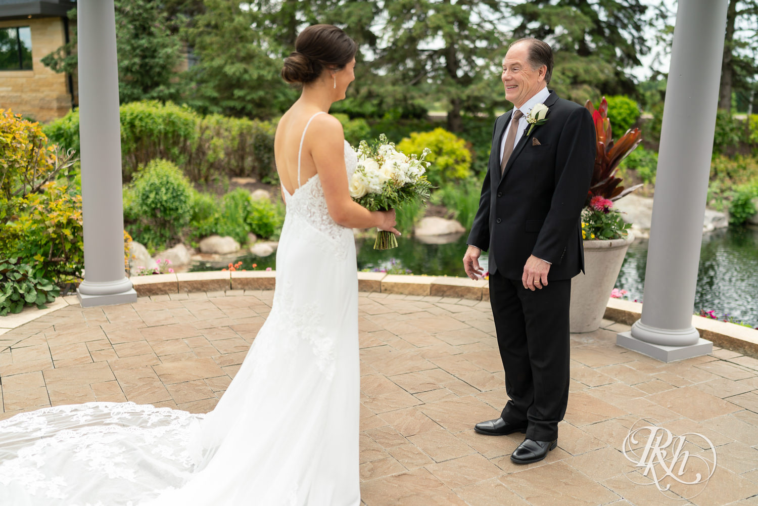 Bride shares first look with her dad at Olympic Hills Golf Club in Eden Prairie, Minnesota.