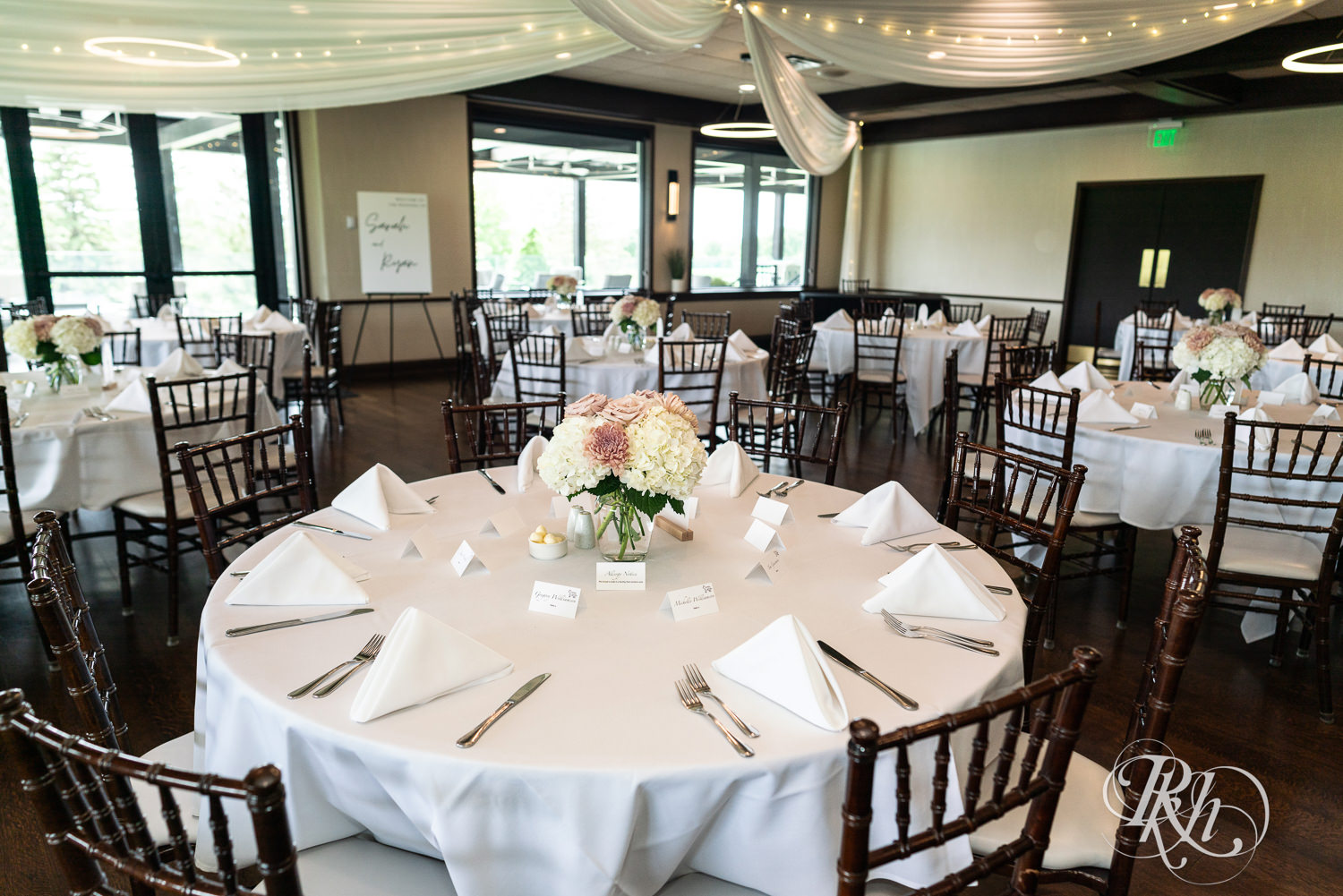 Indoor wedding reception setup at Olympic Hills Golf Club in Eden Prairie, Minnesota.