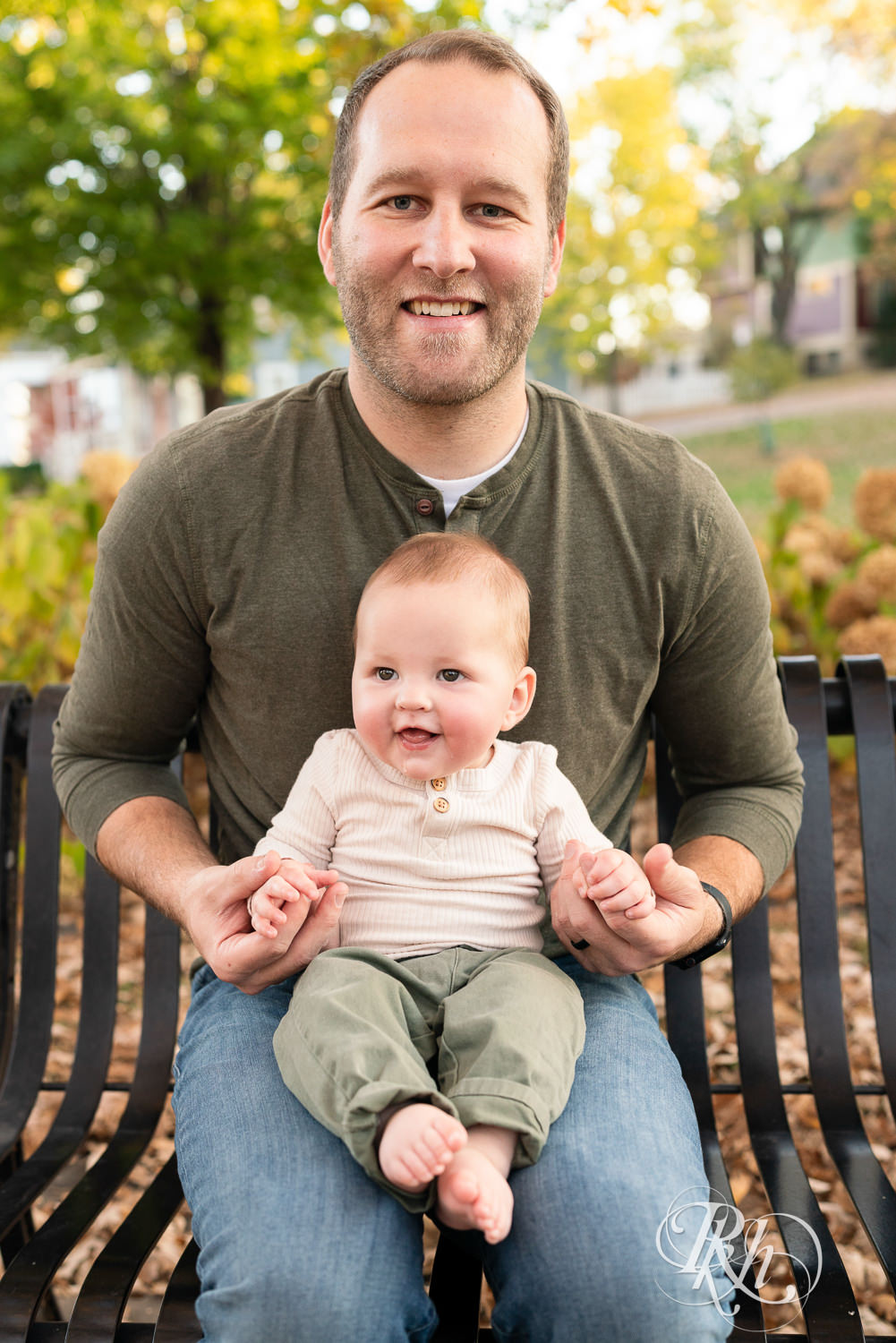  Baby smiles with dad at Irvine Park in Saint Paul, Minnesota.