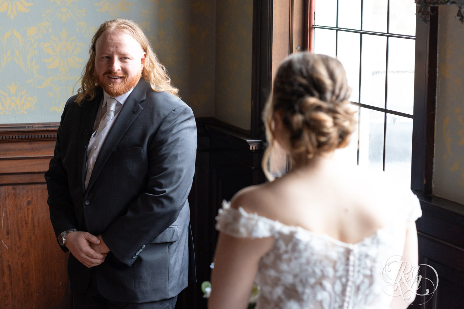 Bride and groom share first look on their wedding day at the Semple Mansion in Minneapolis, Minnesota.