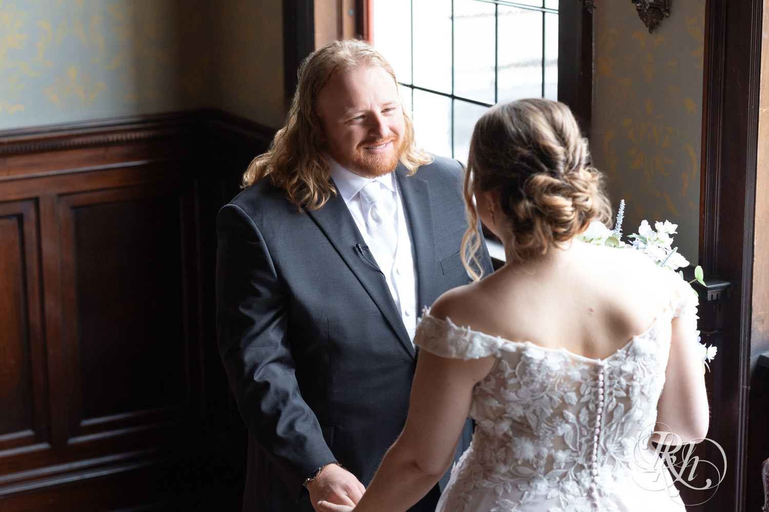 Bride and groom share first look on their wedding day at the Semple Mansion in Minneapolis, Minnesota.