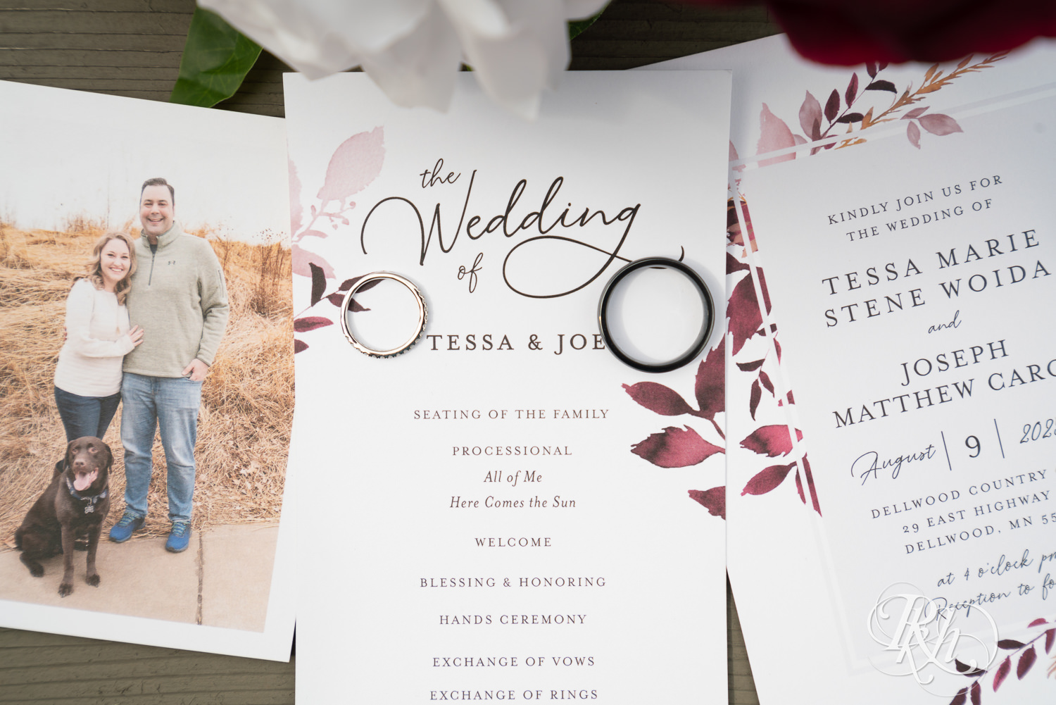 Wedding invites with rings and flowers. 
