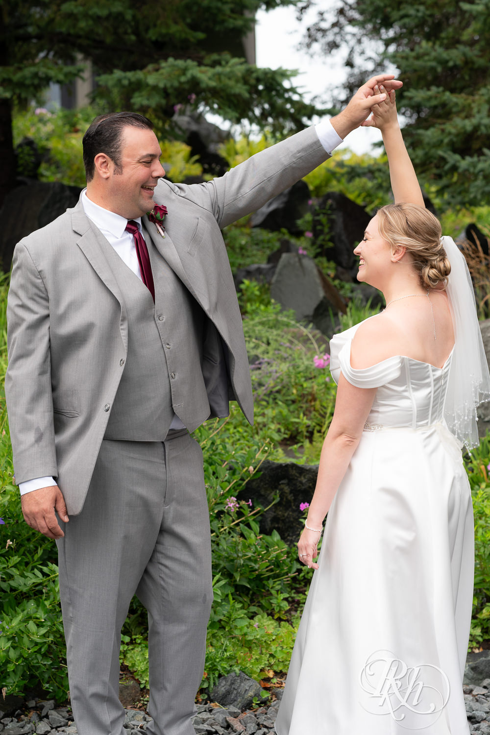 Bride and groom smile on wedding day at Dellwood Country Club in Dellwood, Minnesota.