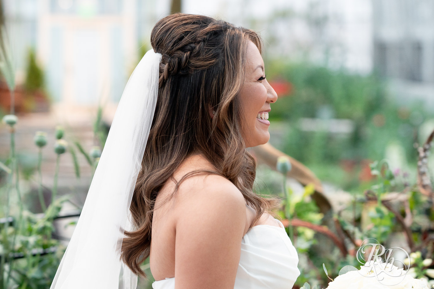 Asian bride and groom share first look on wedding day at the Sunken Garden at the Como Zoo and Conservatory in Saint Paul, Minnesota.